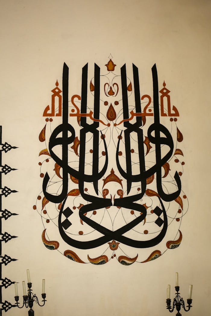 services-04 Elegant Arabic calligraphy design on a wall with traditional motifs and chandeliers.